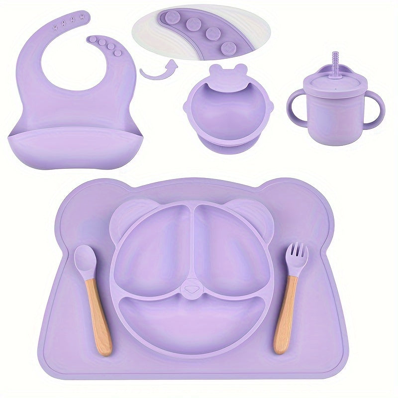 7-piece toddler meal set with silicone utensils in mixed colors, featuring cartoon design and high suction power. Easy to clean and includes placemat, plate, bowl, spoon, fork, bib, and