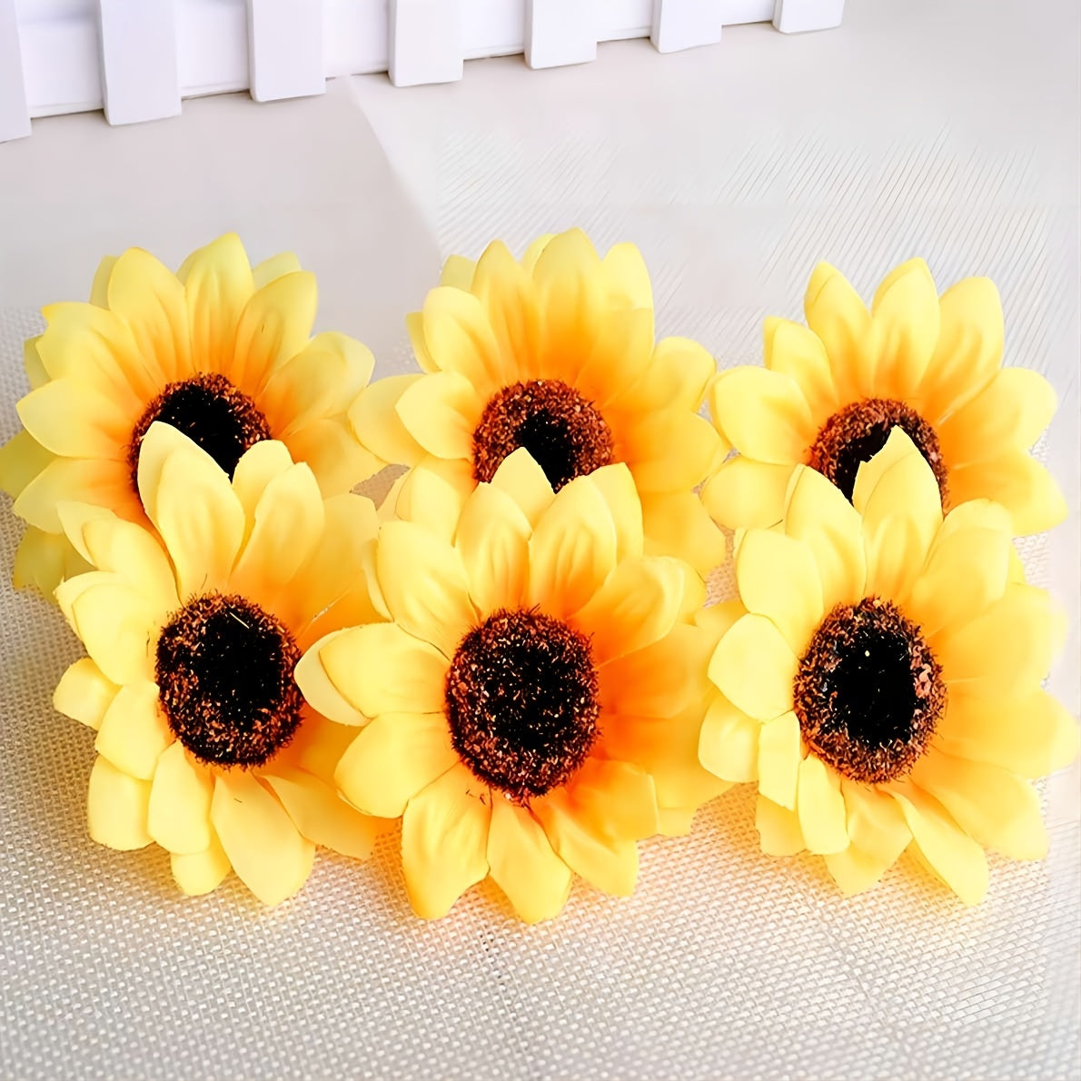 Artificial yellow sunflower heads for DIY wedding decor and gifts.