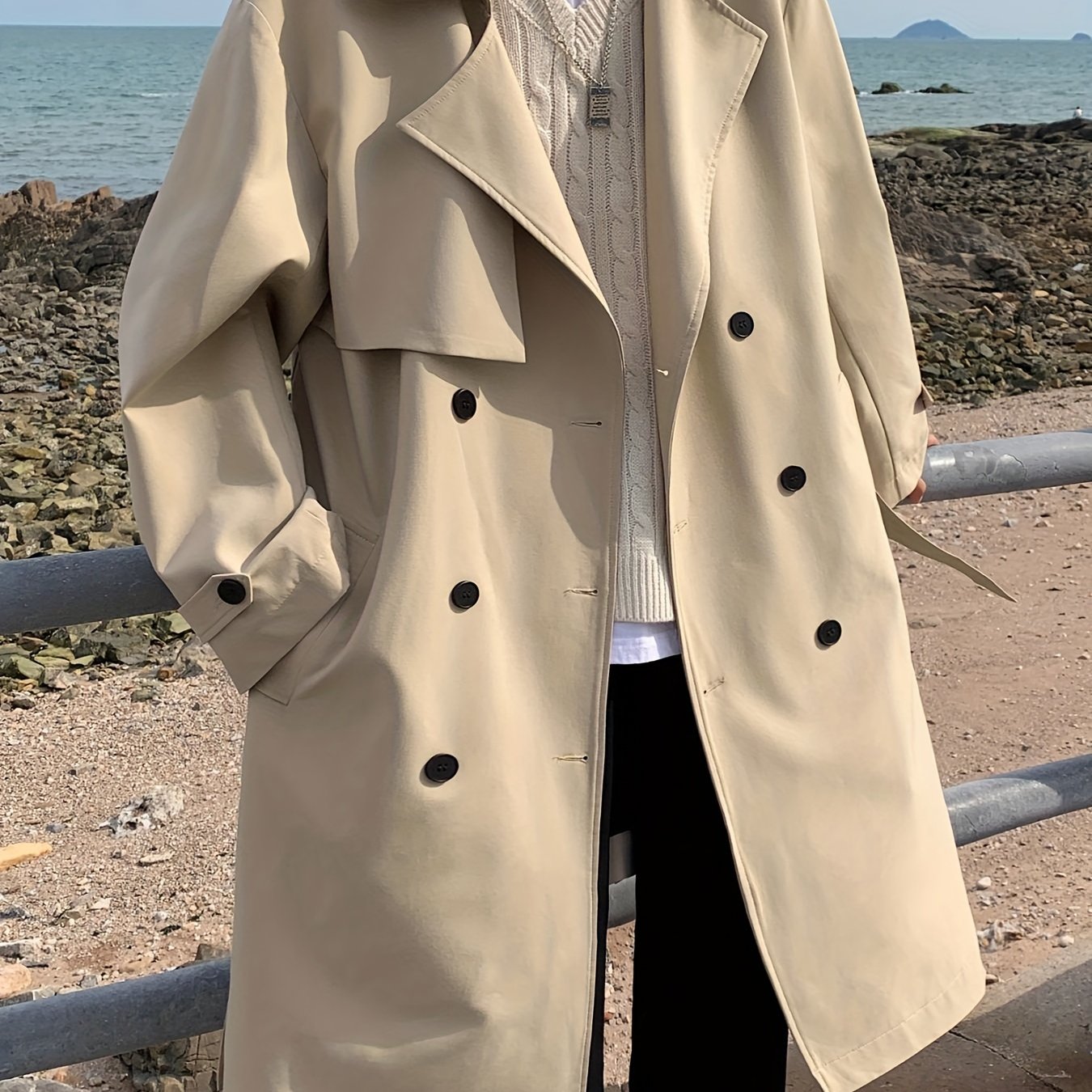 Men's double-breasted overcoat with pockets for outdoor activities.