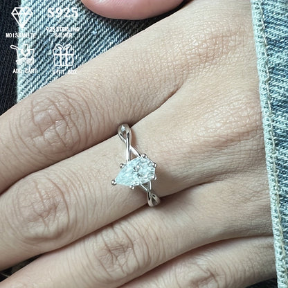 This stunning 1/2ct Pear-Shaped Moissanite Ring is perfect for women who appreciate elegance. Crafted from hypoallergenic S925 Sterling Silver with a twisted six-prong setting, it makes a wonderful anniversary gift or party accessory. Presented in an