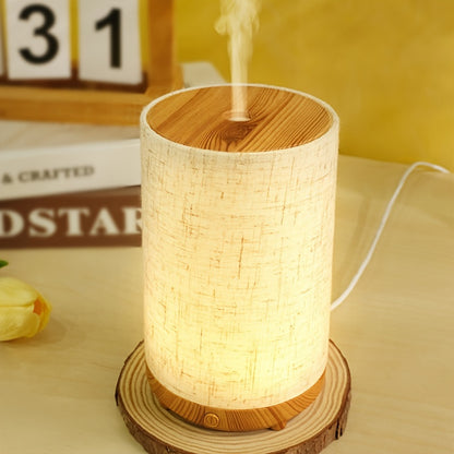 Textured fabric & wooden air humidifier with aromatherapy diffuser, essential oil addition, air purification, auto shut-off, USB powered; ideal for home, bedroom, office, travel gift.