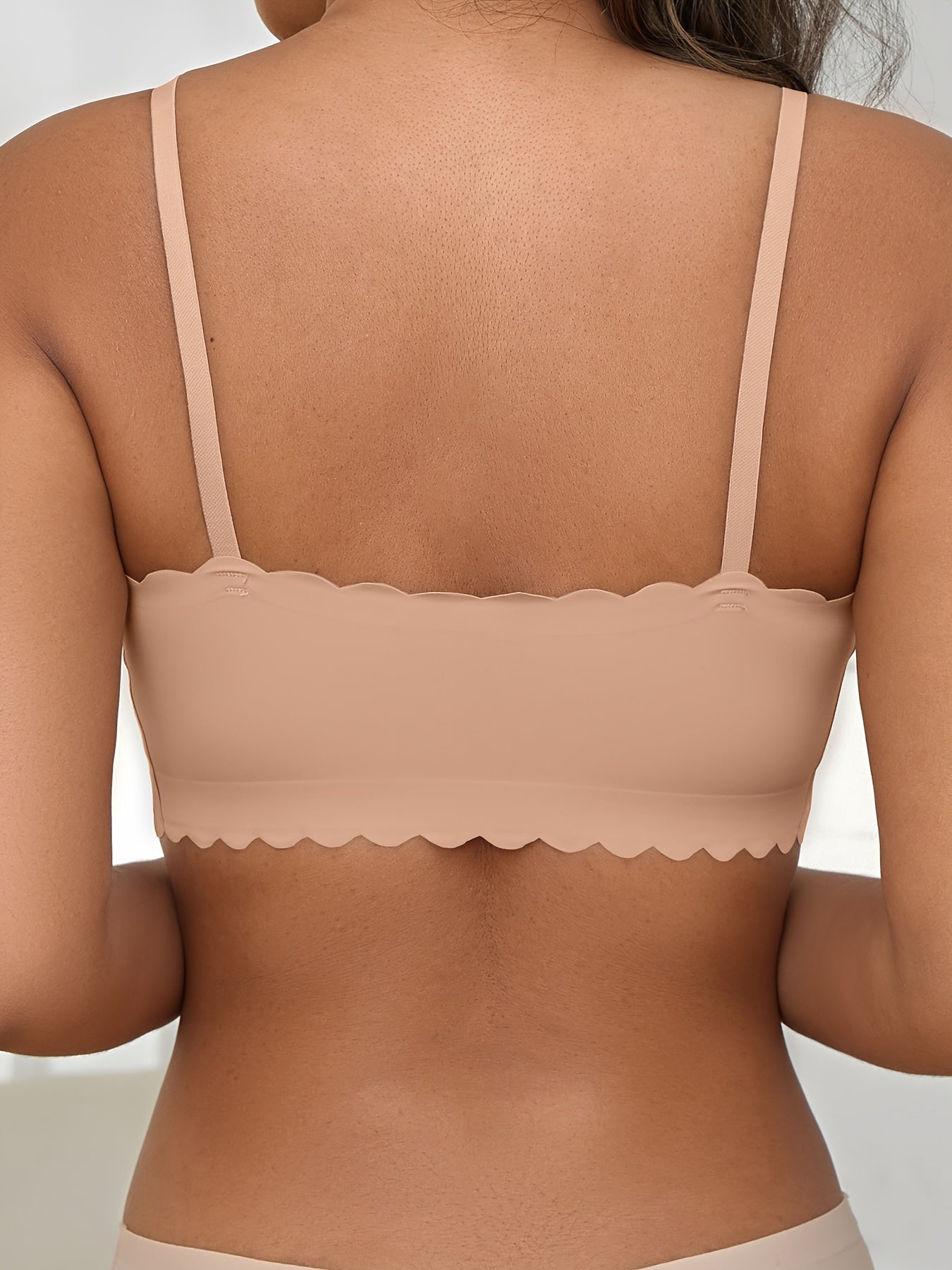 Seamless wireless bra for plus-size women with high elasticity and removable padding, in v-neck solid color.