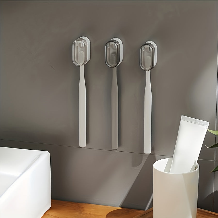 Wall-mounted toothbrush holder with cover, suitable for bathroom storage and decoration.