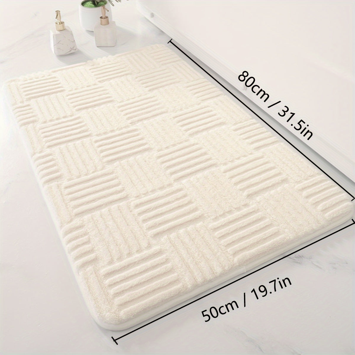 One piece of a thickened bathroom absorbent mat with a non-slip bathtub rug. Can also be used as a home entryway carpet with a solid color and stripe pattern. The mat is rectangular in shape and lightweight, machine-made with a PVC backing. Made of