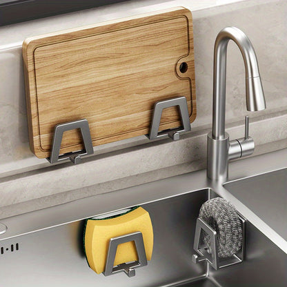 Double up on your kitchen sink organization with this space-saving organizer. No need for drilling - simply stick it on with the self-adhesive backing. Made of stainless steel, this rack holds sponges and soap with drainage holes for easy drying. Perfect