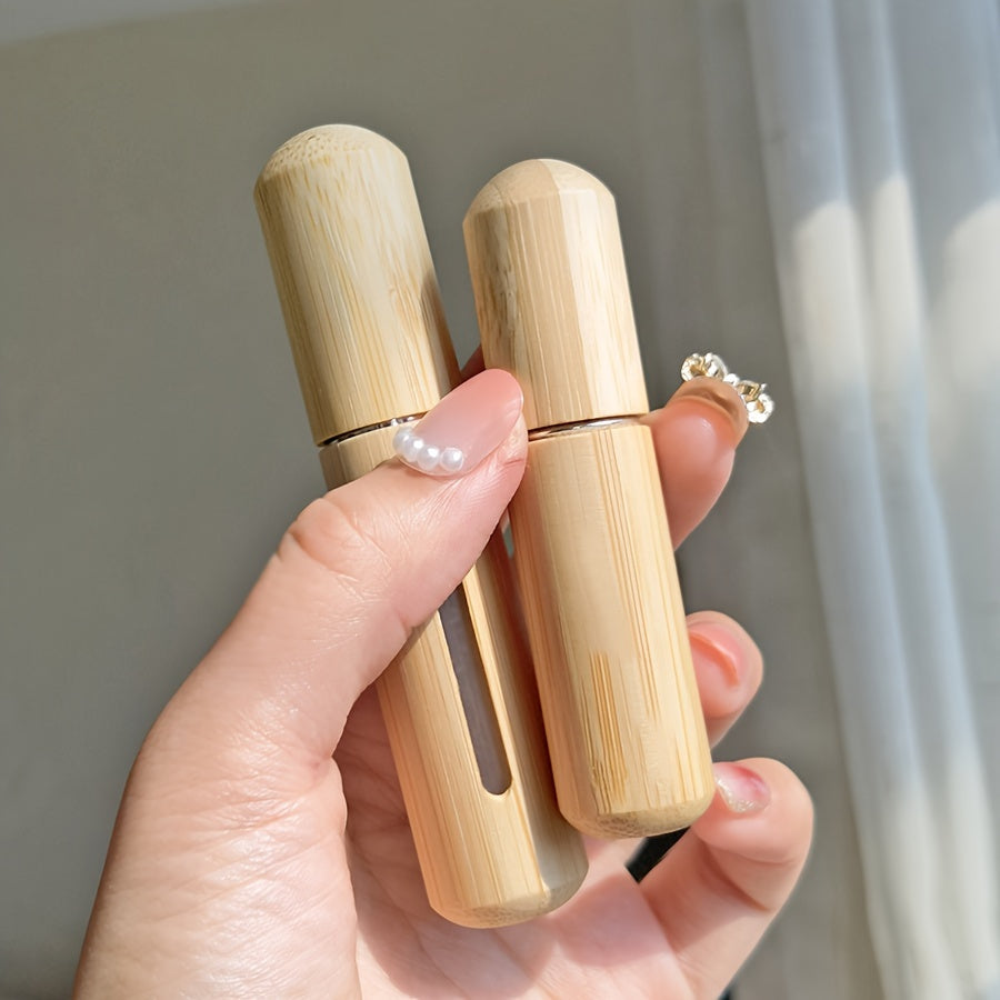 Set of bamboo shell perfume atomizers, refillable spray bottles in 5ml & 8ml sizes. Portable and luxurious fragrance dispensers with visible window, ideal for travel and outdoors.