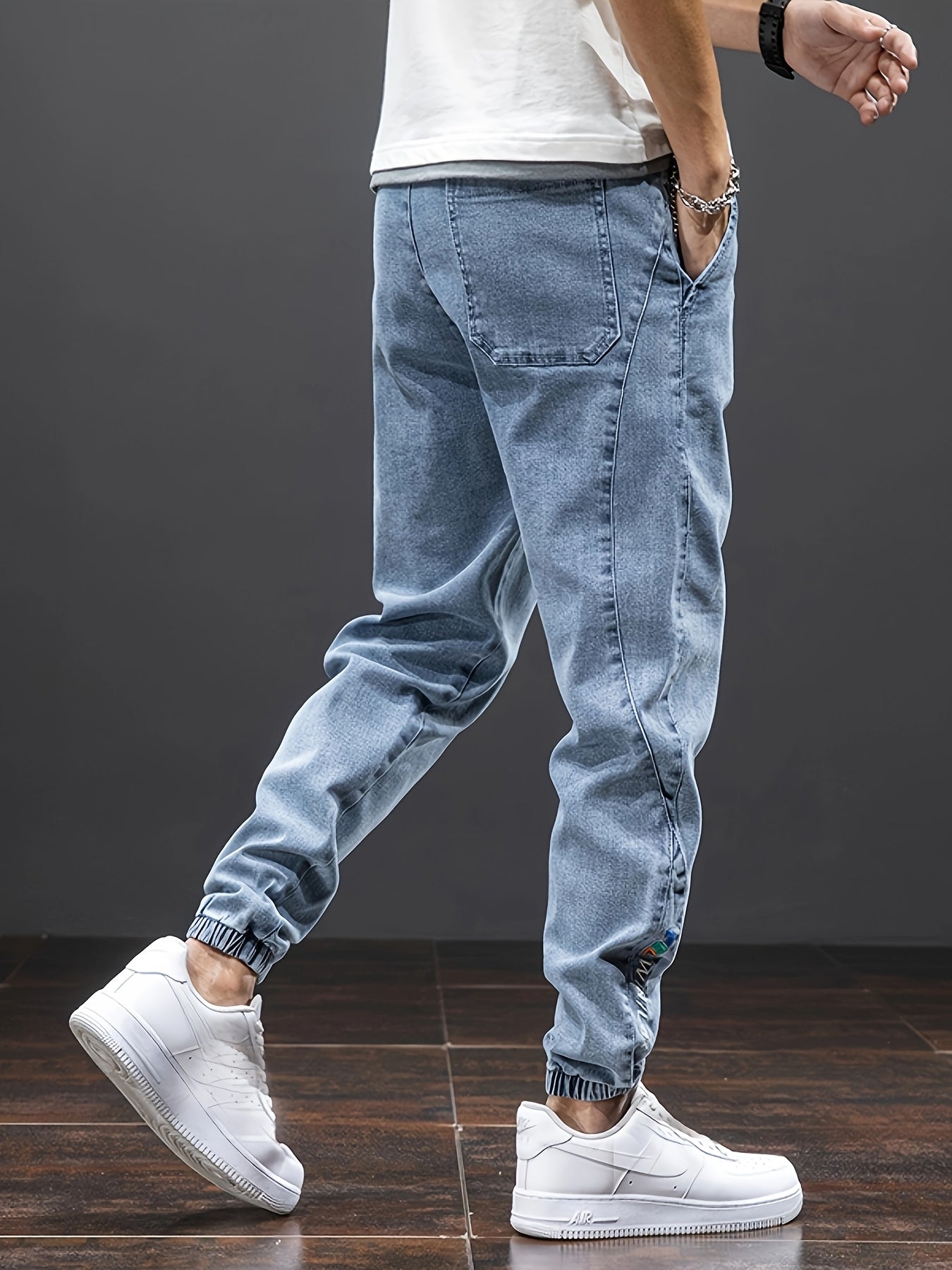 Men's mid-rise cropped jeans with elastic waistband made of 70.7% blend, solid color washed denim, regular fit for all-season wear.