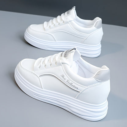 White lace-up sneakers with thick soles, perfect for casual wear.