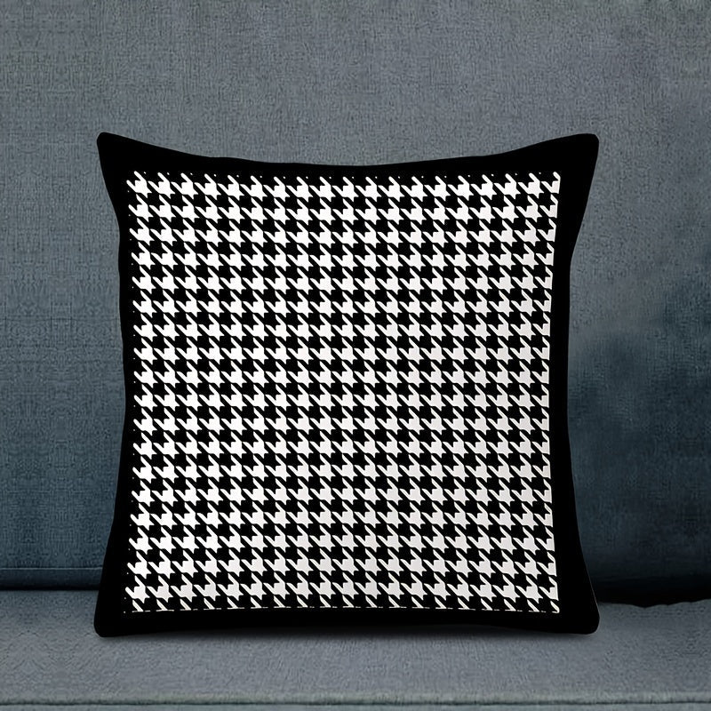 This reversible Contemporary Houndstooth Throw Pillow Cover measures 44.96cm and features a zipper closure. Made of woven polyester, this machine washable cushion case is perfect for living room decor. The black and white design adds a modern touch and