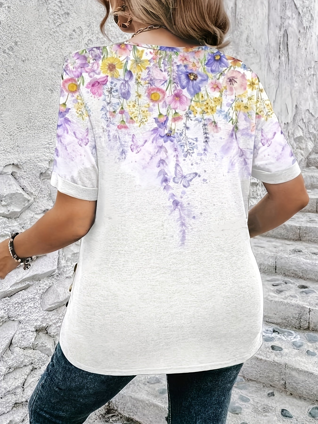 Stylish plus-size women's short-sleeve t-shirt with printed buttons and round neck.