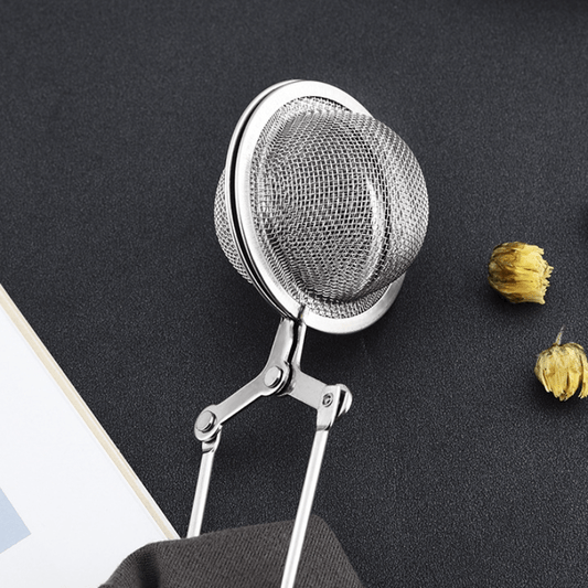 Tea lovers can now enjoy the convenience of the Stainless Steel Tea Infuser with its easy press-to-press handle. This simple and practical metal tea strainer is a must-have kitchen and dining accessory, perfect for filtering tea at home.