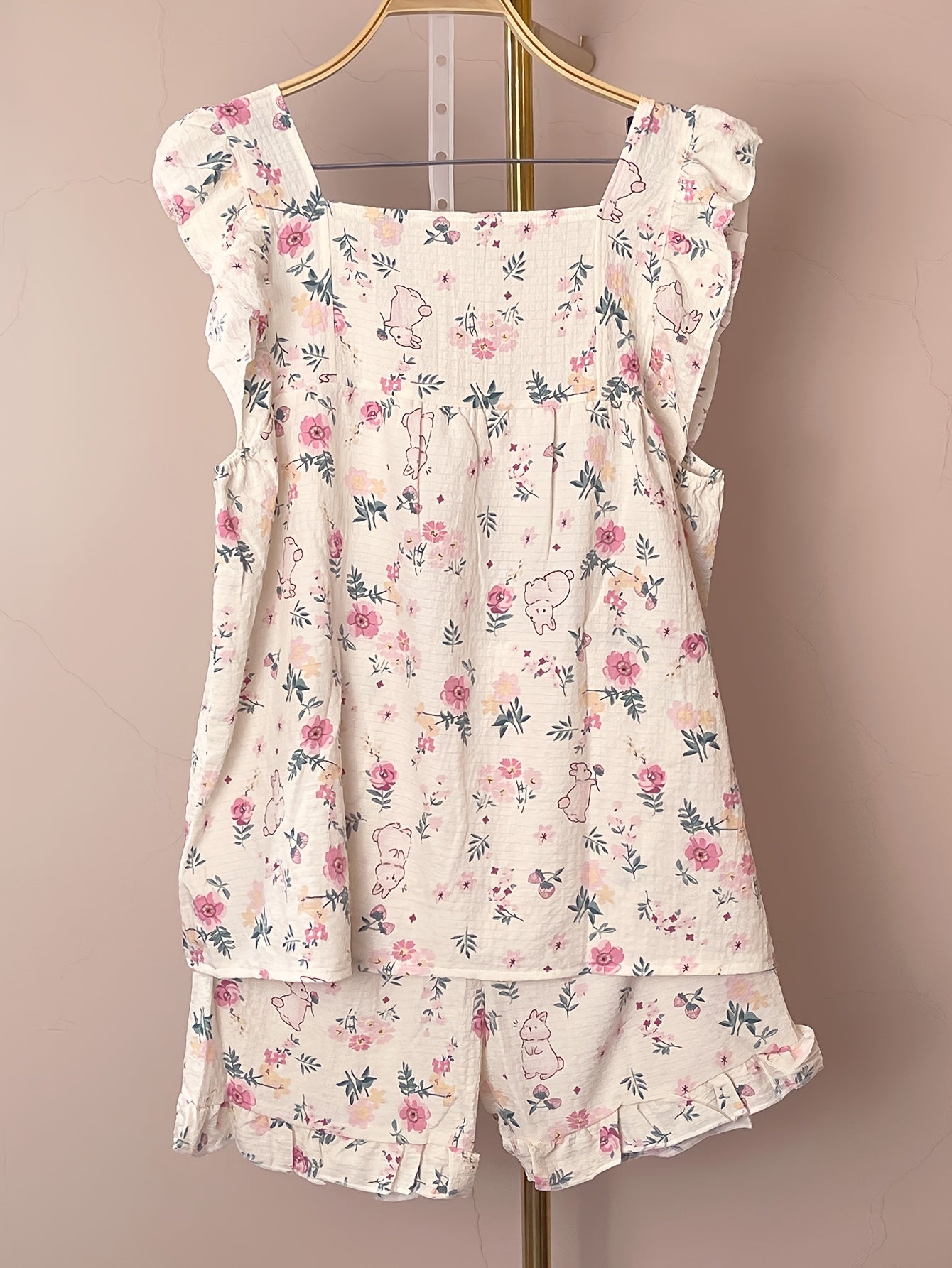 Women's loungewear set with ruffle sleeve top and elastic shorts featuring cute rabbit and floral print.