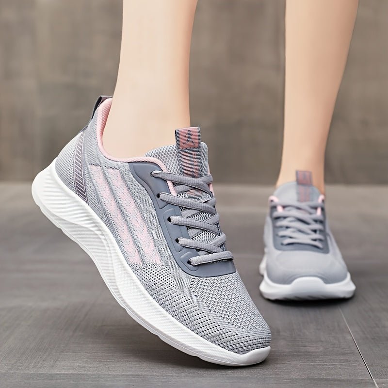 Breathable mesh running shoes for women with lightweight design, lace-up closure, fabric upper, and PU sole.