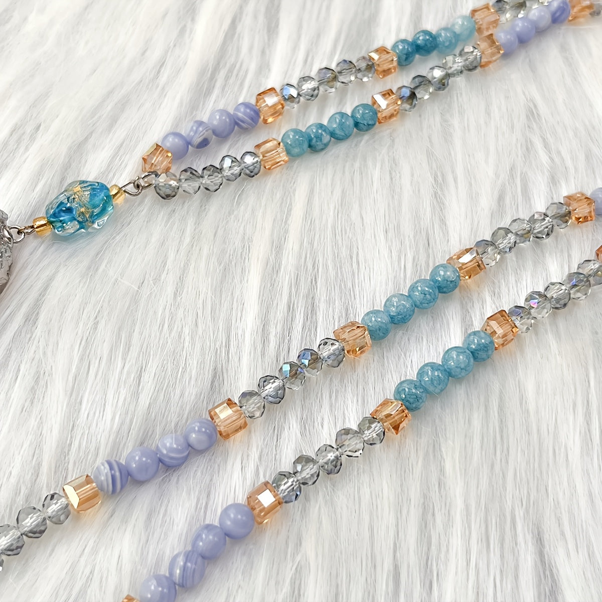 Unique vintage-inspired mala necklace featuring a raw kyanite pendant, beautiful blue lace agate and amazonite beads. Hand-beaded with love, this crystal japamala promotes chakra mindfulness and inner peace. This elegant boho accessory is perfect for any