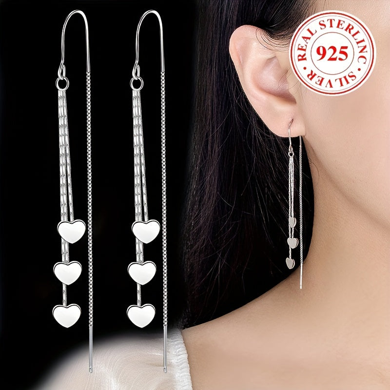 Elegant and simple, these glossy heart chain tassel dangle earrings are made of hypoallergenic sterling silver (925). The perfect delicate gift for a female, they will add a touch of elegance to any outfit.