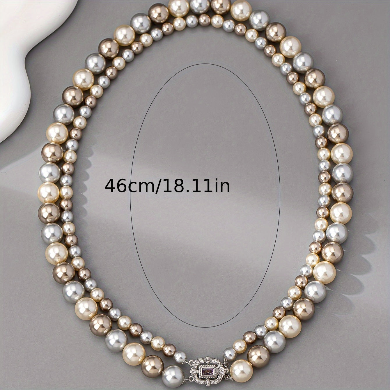 For special occasions and weddings, adorn yourself with our exquisite double-strand pearl necklace featuring 22K golden plating and a zirconia clasp. This elegant piece comes with detachable layered imitation pearls for a timeless and luxurious look.