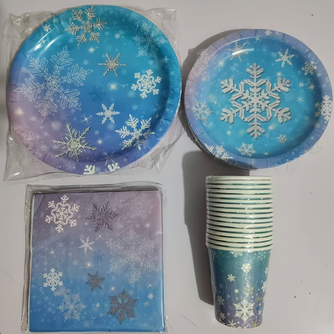 Winter Wonderland Party Supplies Set - Blue & Purple Snowflake Themed Tableware Kit with 68 Pieces, featuring Disposable Paper Plates, Cups, and Napkins for Christmas, New Year's, and Birthday Celebrations. Perfect for Festive Events and Essential for a