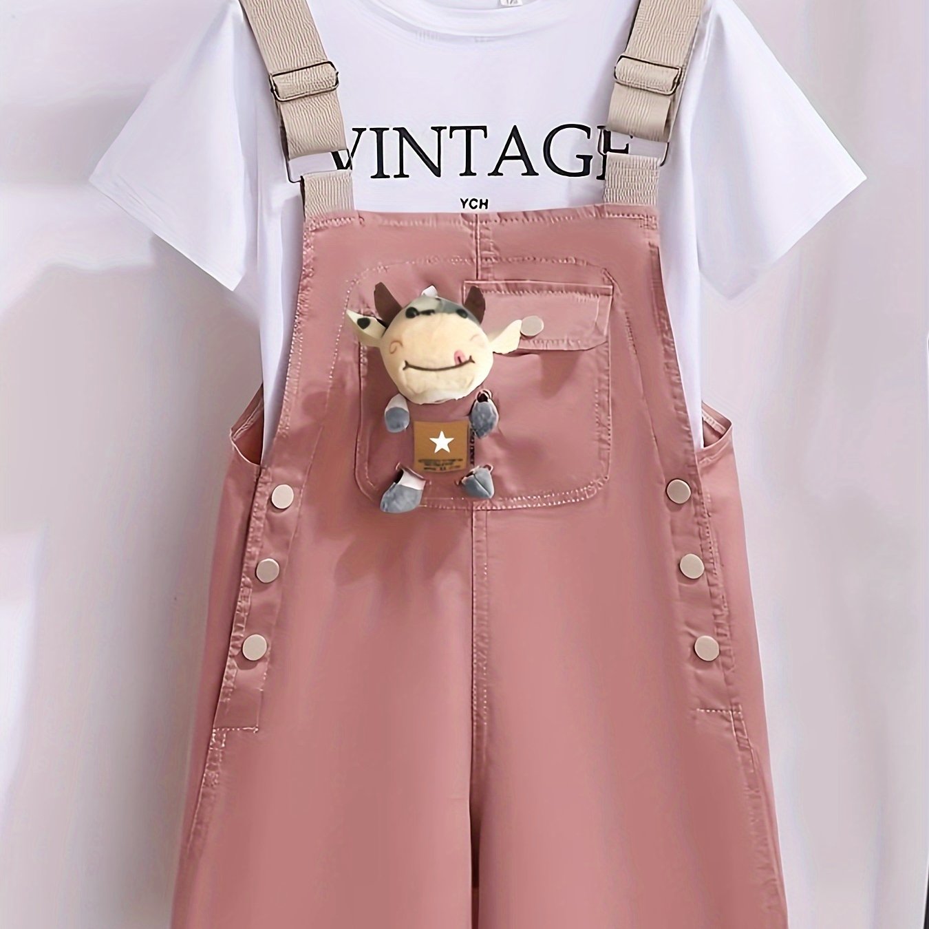 Girls' summer outfit with trendy suspenders and lightweight overalls for outdoor wear.