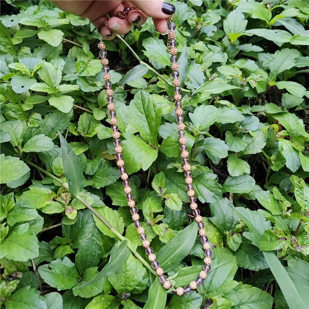 This sophisticated beaded necklace features stunning color-changing synthetic Sultanite Diaspore, unadorned by plating. It is a versatile piece of jewelry perfect for both everyday wear and special occasions.