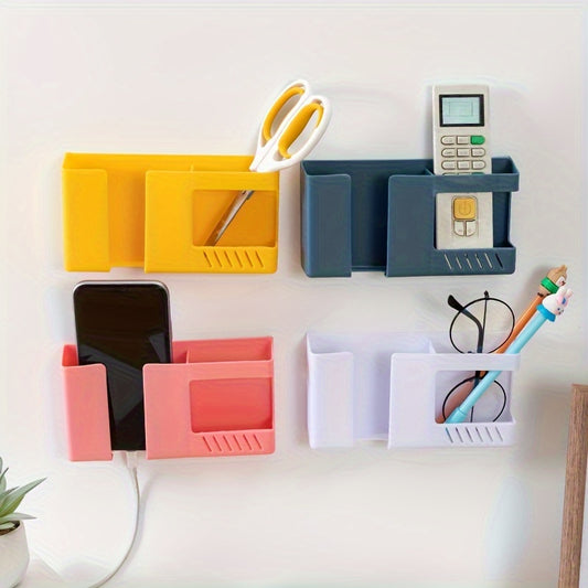 Colorful wall-mounted storage rack for organizing various items like remote controls and smartphones in a space-saving design. Easy to install and durable, available in yellow, green, pink, and white for home and office use, with utility hooks.