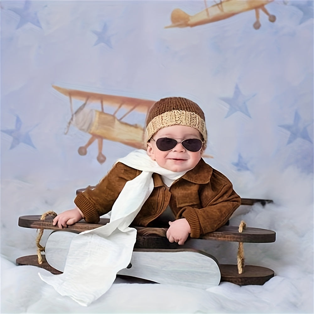 Props for newborn photography, including a wooden plane, baby furniture, and studio accessories for boys and girls. Baby bed and chair in the background of studio photos.