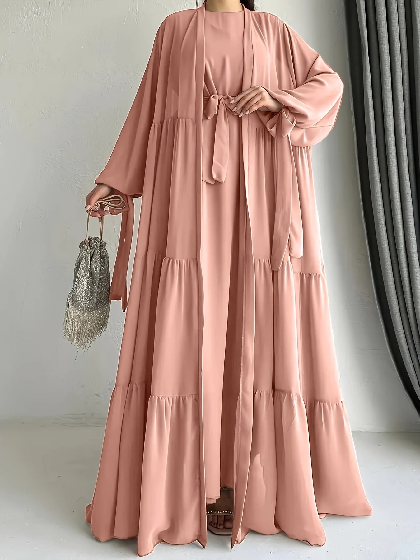 A stylish Middle Eastern Abaya set with vest and belt, featuring a chiffon H-Line robe with side split, lantern sleeves, and ruffle hem detail - perfect for all seasons.