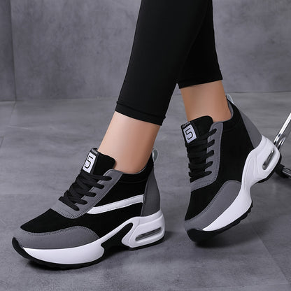 Chunky lace-up sneakers with air cushion for outdoor walks feature hidden heel for added fashion.