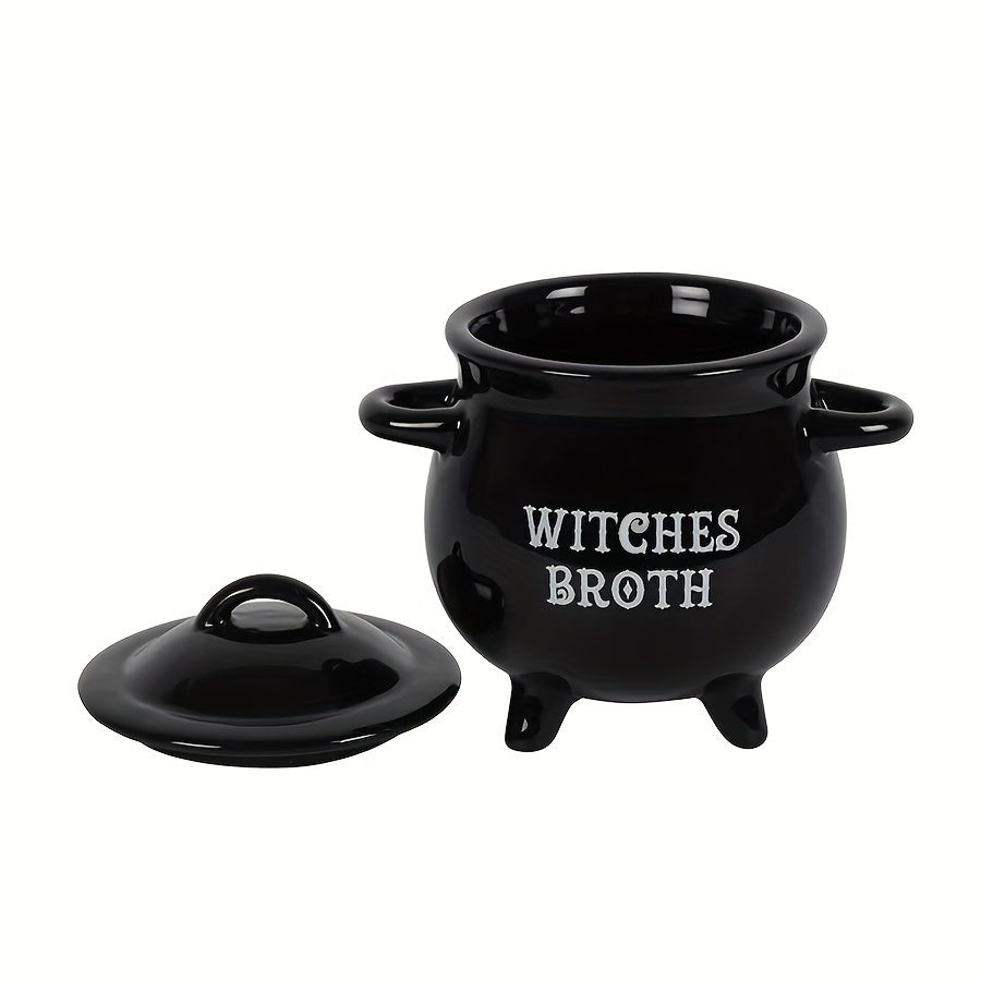 Large Halloween-themed soup pot made of ceramic with a lid, perfect for storing candy and cookies. This magic witch's potion cup is a great addition to your kitchen and dining decor. It is food-safe and can be used for serving deliciously spooky treats.