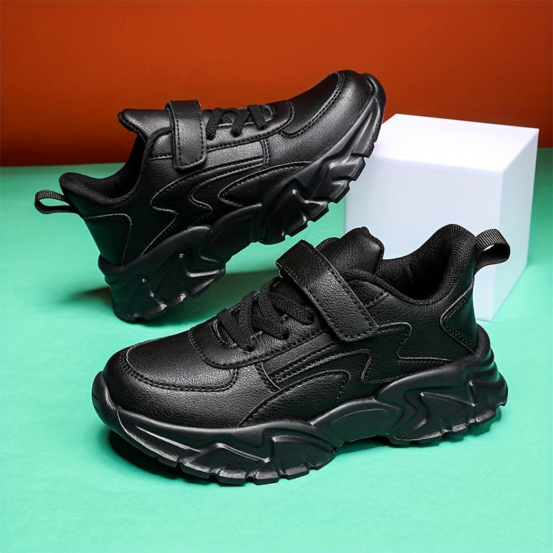 Black boys' footwear with water-resistant, hook-and-loop strap, and soft EVA sole - versatile for running.