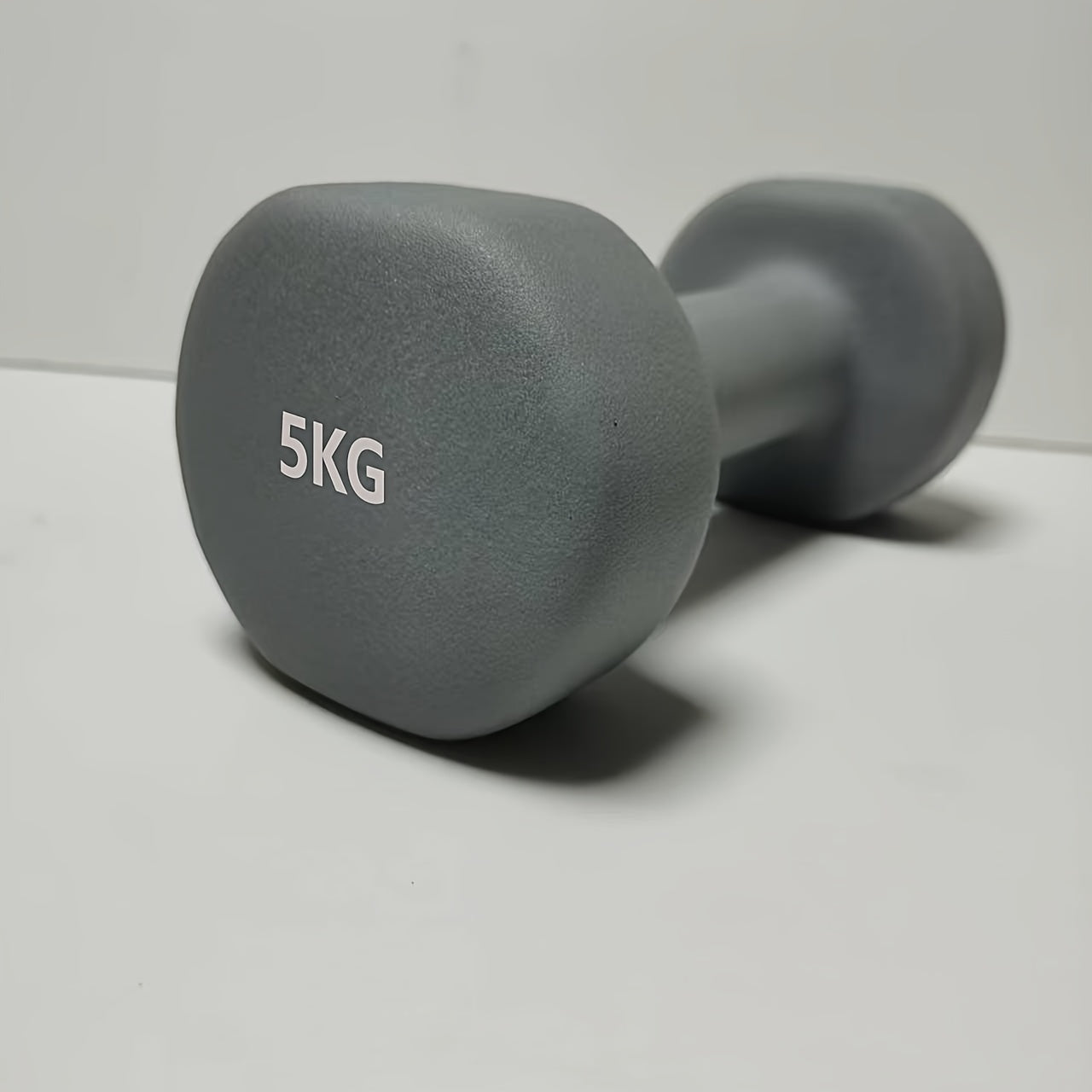 1pc 2kg dumbbell in pink/blue/black colors, made of solid cast iron for home gym. Durable and stylish fitness accessory for both men and women.