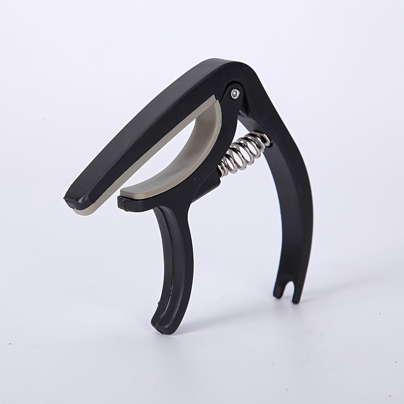 Nylon guitar capo for easy tone adjustment on acoustic, classic, electric guitars, and ukuleles.