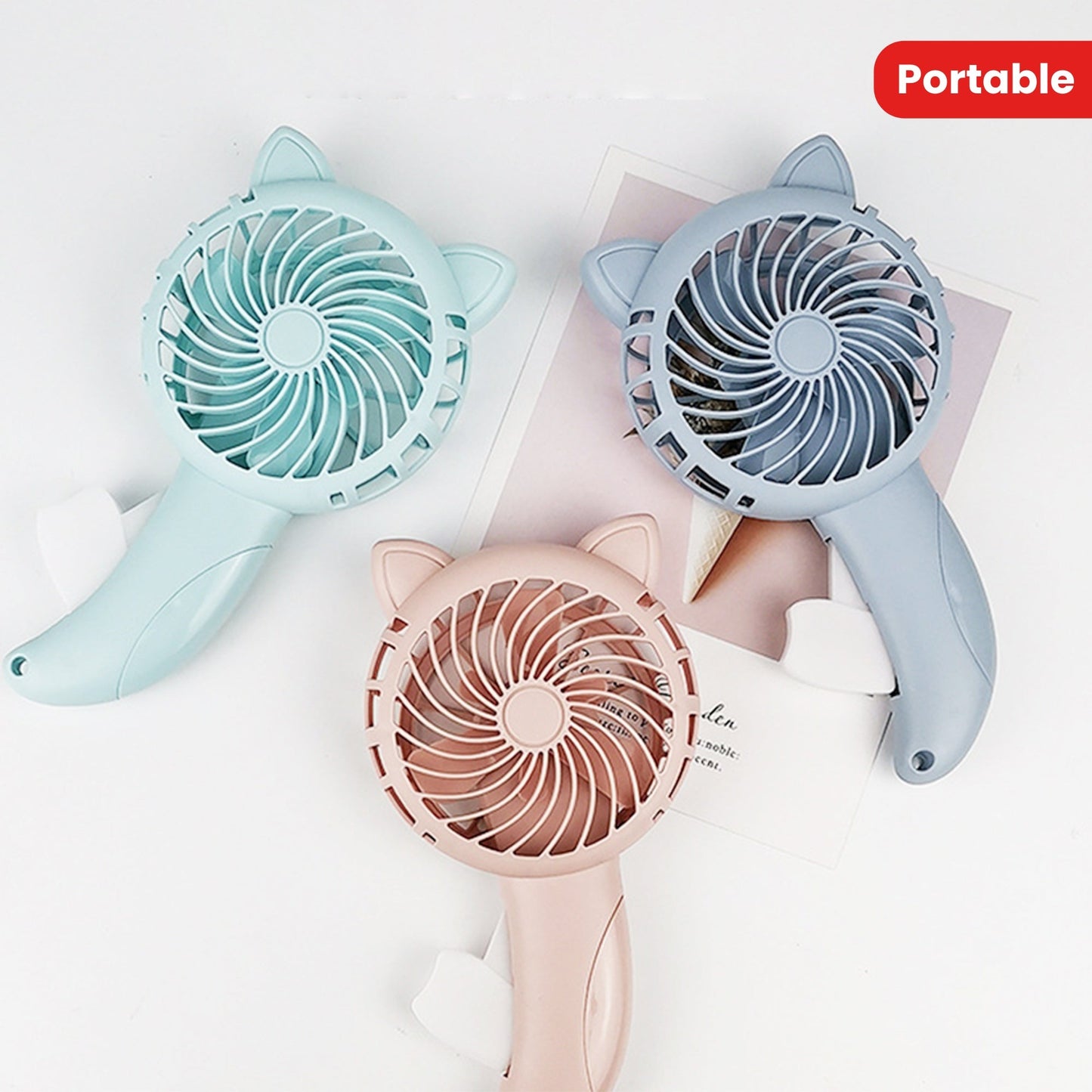 Mini portable handheld fan, no battery needed - perfect for keeping cool in the summer! Features three colors and a cute cartoon design, making it a stylish addition to any household.