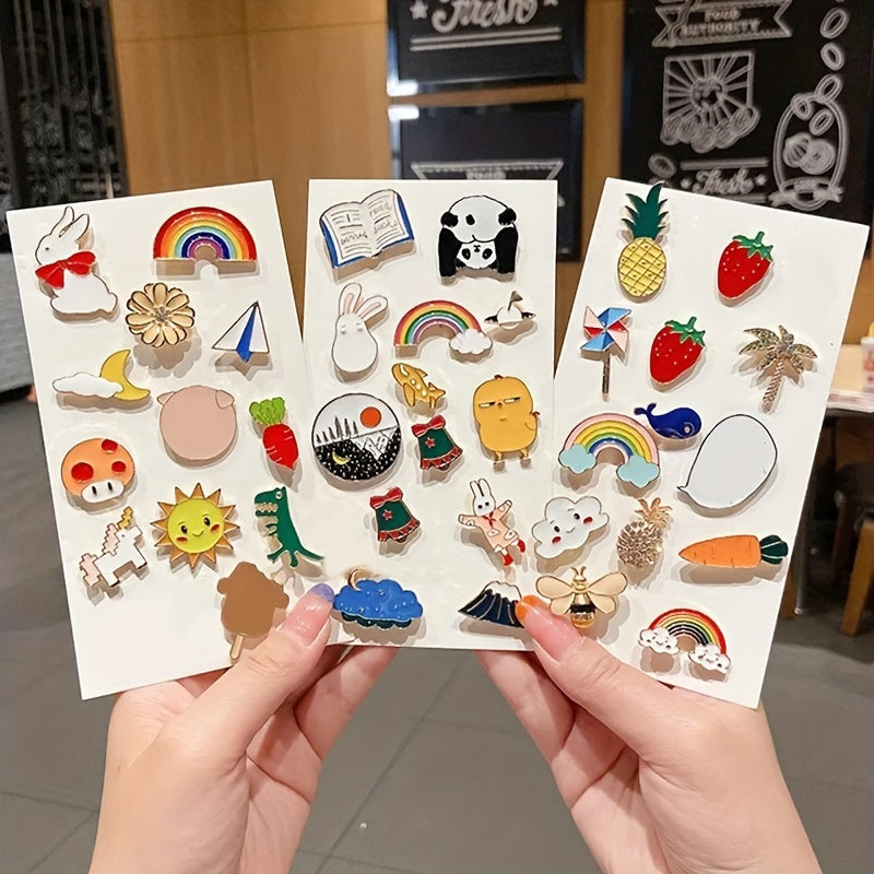 Set of YWLI Brooch Pins in assorted cute alloy metal designs, available in 10, 20, 30, or 50 pieces. These novelty pins feature irregular shapes and minimalist adhesive backings, making them a fashionable accessory for women.