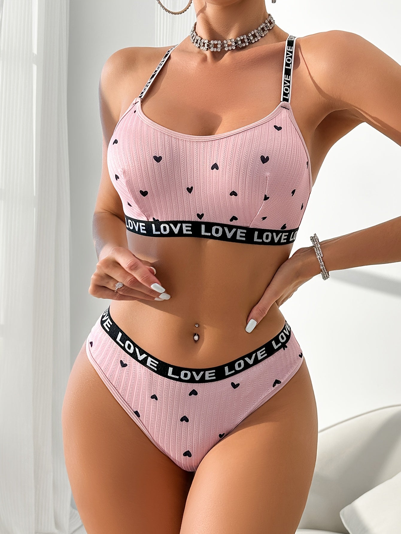 Women's sexy heart print lingerie set made from polyester knit fabric with LOVE strap detail, braid accent. Adult intimate apparel.