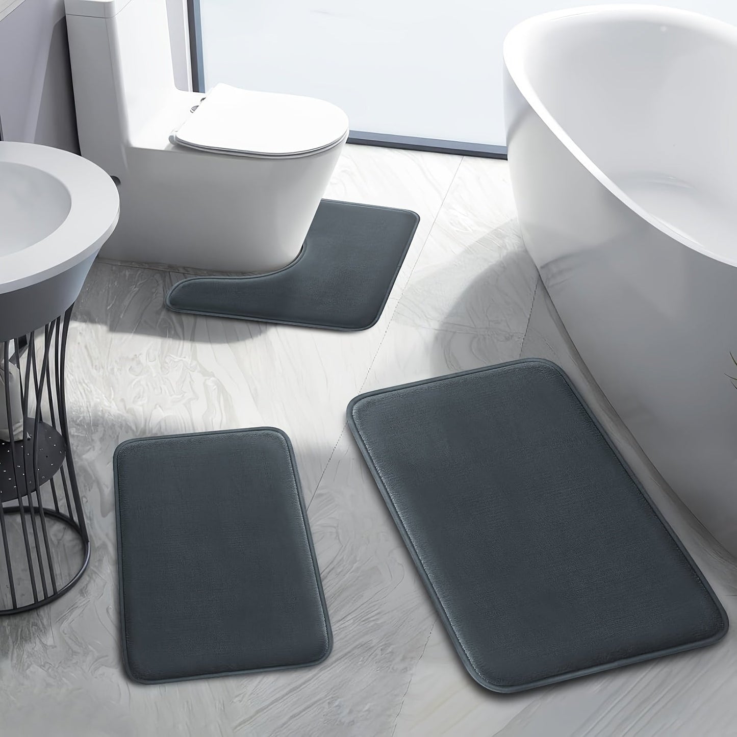 One set of three extended memory foam bath mats featuring a durable non-slip design. Set includes a U-shaped mat, toilet lid cover pad, and cozy bathroom decor for bedroom and living room. Suitable for use in spring, summer, autumn, and winter with a