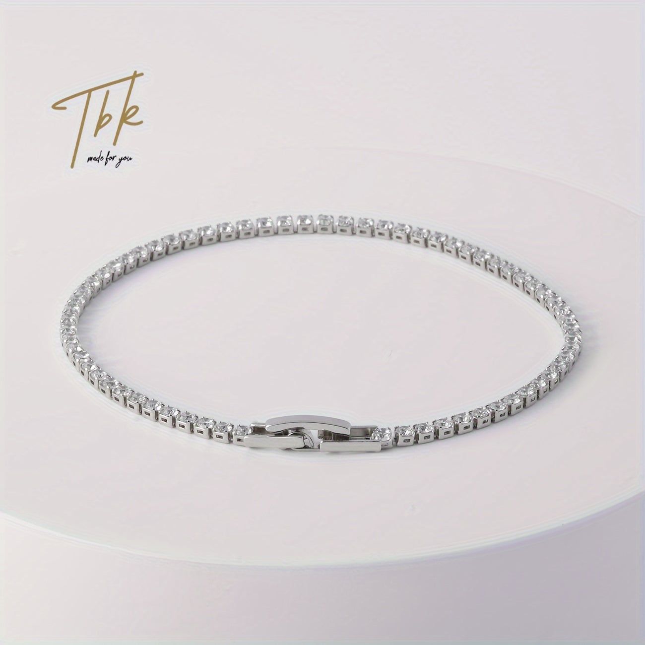 Ice up with this dazzling zirconium-studded tennis bracelet made of shiny titanium steel, presented in a gift box for an extra touch of luxury.