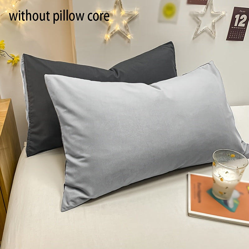 Basic set of 2 rectangular pillowcases made of 90g solid color fleece material, featuring an envelope closure design. These pillowcases are ultra soft, breathable, and machine washable, suitable for use in bedrooms, guest rooms, hotels, and more. The