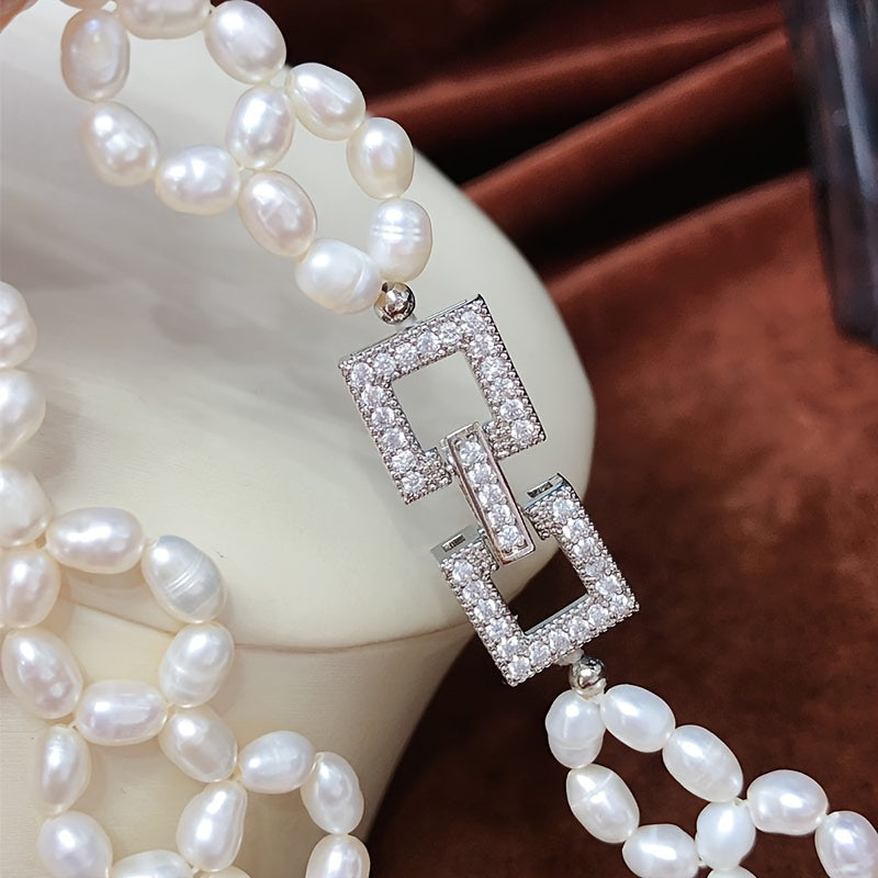 Elevate your style at parties, holidays, and special occasions with this exquisite, handcrafted clavicle chain inspired by delicate French vintage designs. This luxurious freshwater pearl necklace is sure to add a touch of elegance to any outfit.