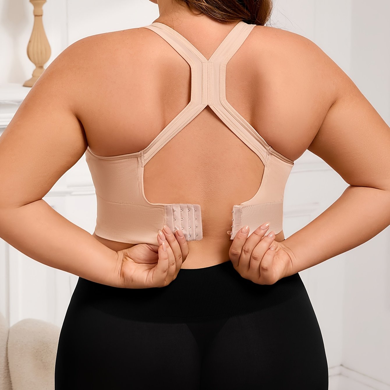 Plus Size Seamless Sports Bra made of solid color knit fabric with medium stretch, composed of 83% polyamide and 17% elastane. Features removable padding, wireless design, and a lightweight