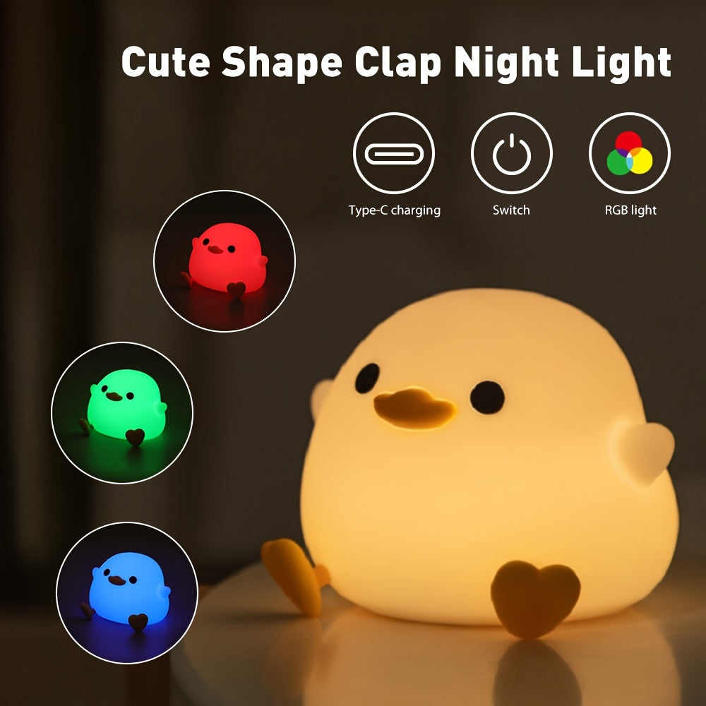 Cute duck-shaped touch control night light with RGB color changing, soft silicone bedside lamp, USB-C rechargeable desk light, perfect gift for any room.