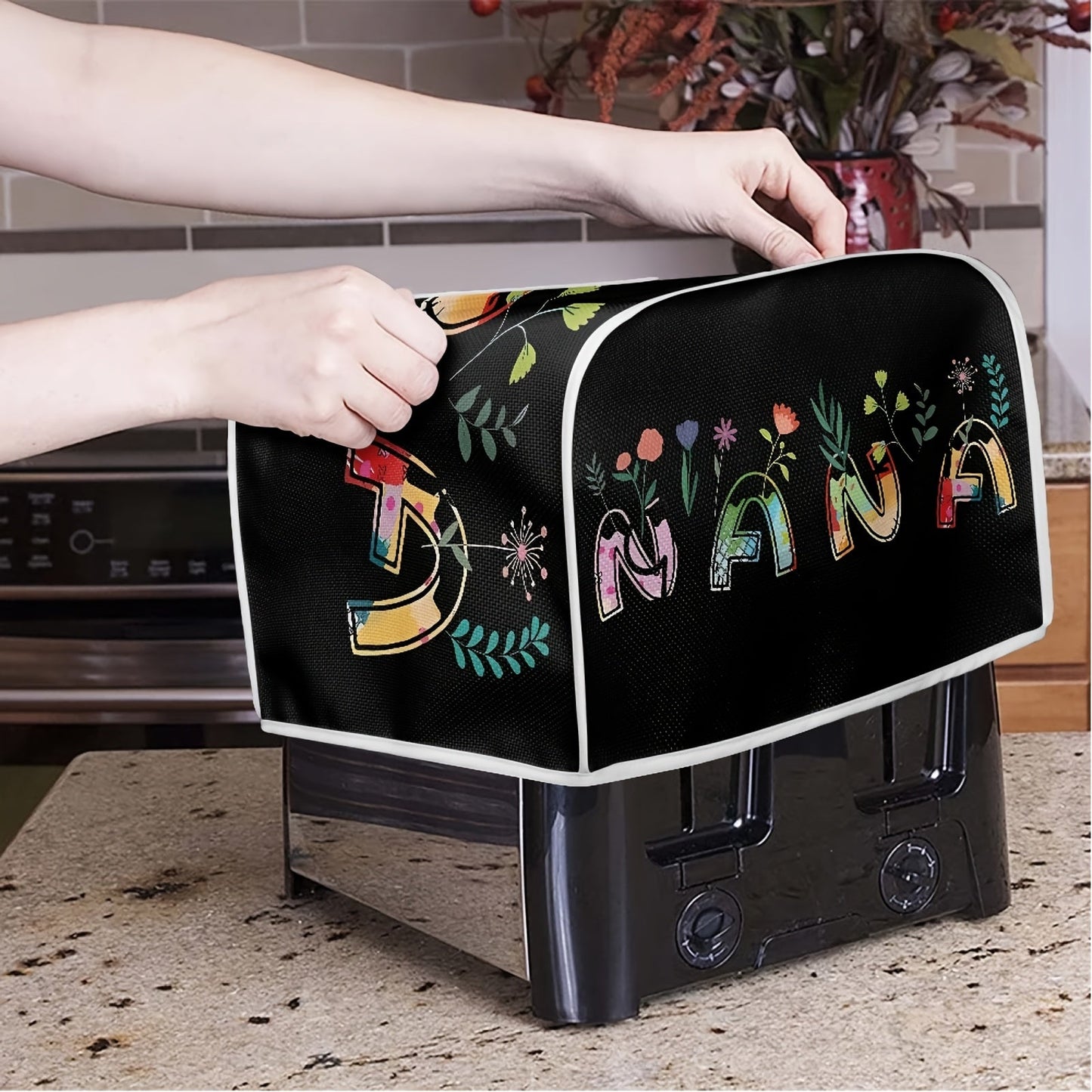 Protect your small appliance and enhance your kitchen decor with this 1pc Classic letter print Toaster Cover. Designed for 2 Slice Wide Slot toasters, this cover provides dustproof, fingerprint, and grease protection. It is machine washable, making it