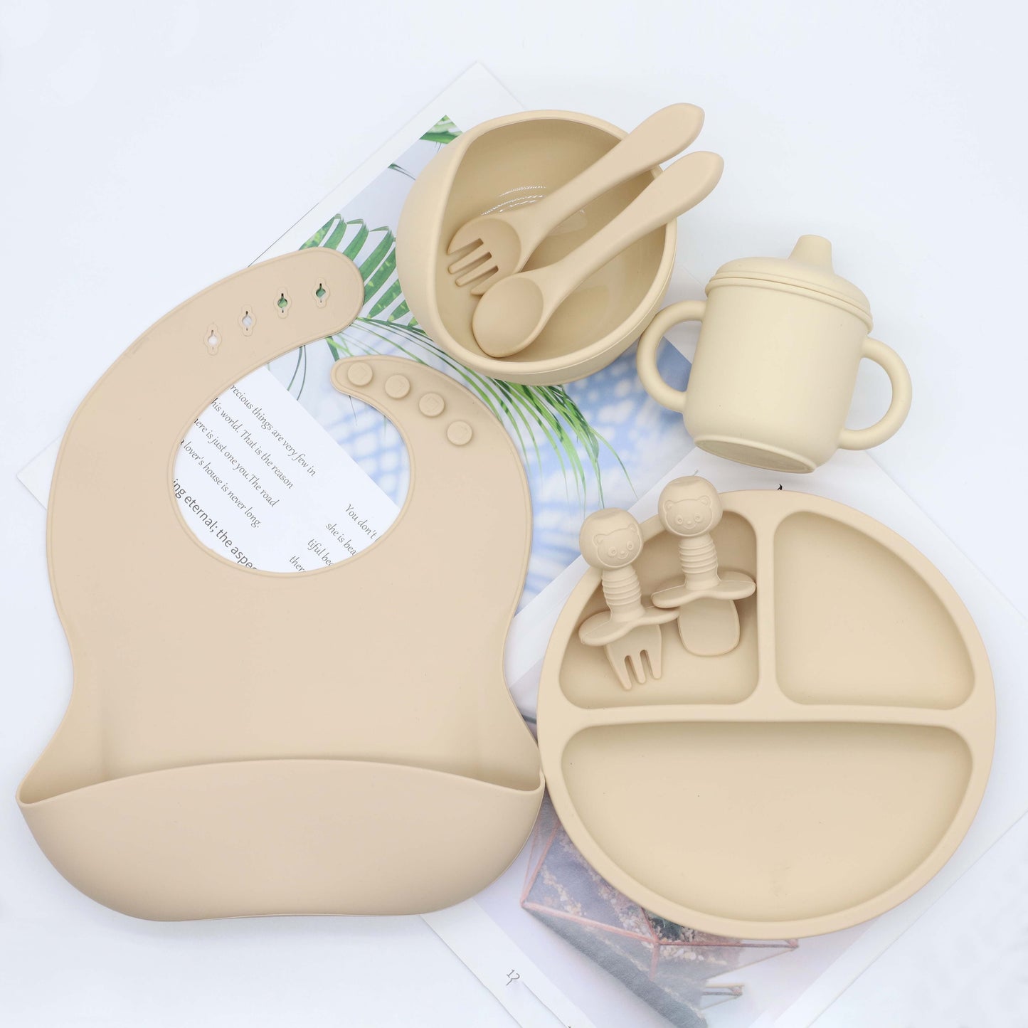 Set of 8 pieces of food grade silicone tableware including a feeding bib, plate, bowl, cup, silicone spoon, fork, and short spoon fork set. Perfect for gifting on Christmas, Halloween, Thanksgiving Day, New Year's, Valentine's Day, and Easter.