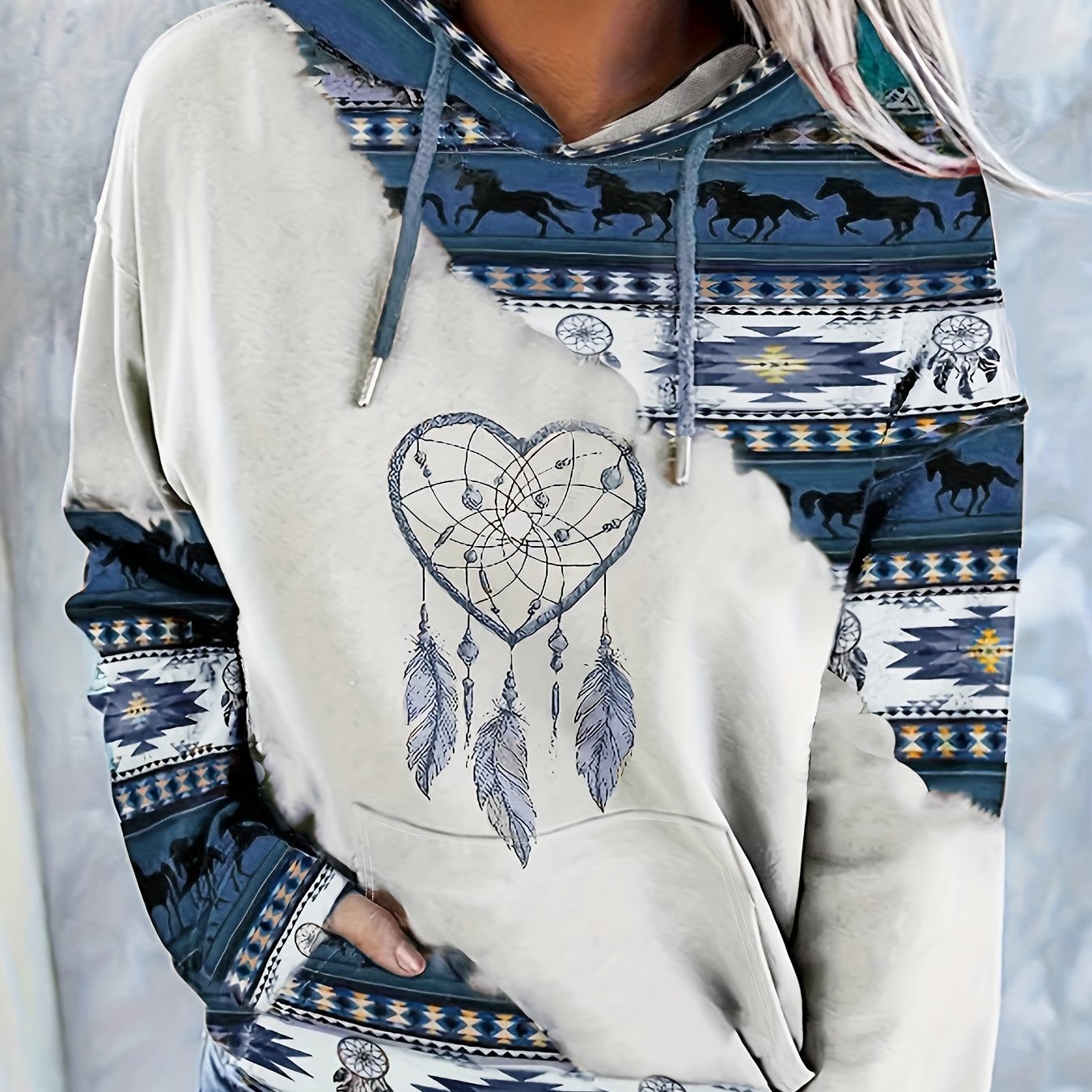 Casual hooded sweatshirt for women with ethnic print, knit fabric, and drawstring.