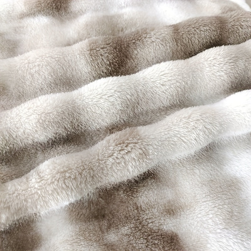 Soft and plush faux fur throw blanket for ultimate luxury and comfort. Perfect for cozying up on the couch or adding a touch of elegance to your bedroom or living room. Machine washable for easy care, suitable for all seasons. Measures 99.06x149.86cm.