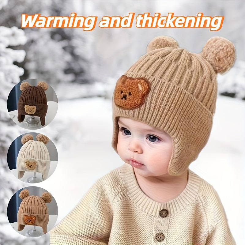 Soft polyester knit hat with cozy bear theme and ear warmers for young children, perfect winter gift for boys and girls aged 0-3 years. Comes in khaki, coffee, and ivory colors.