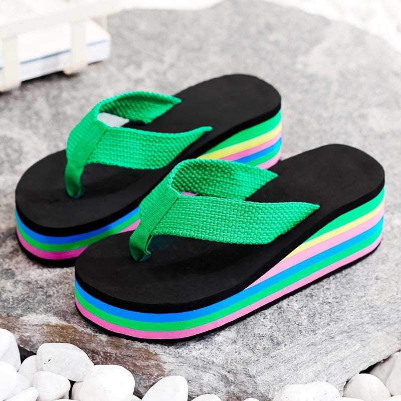 Summer clog flip flops with high heels and rainbow sole for seaside vacation.