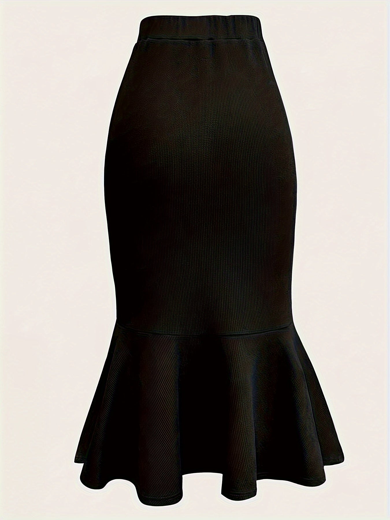 Elegant black mermaid skirt with ruffled hem for all occasions. Made of polyester knit fabric.