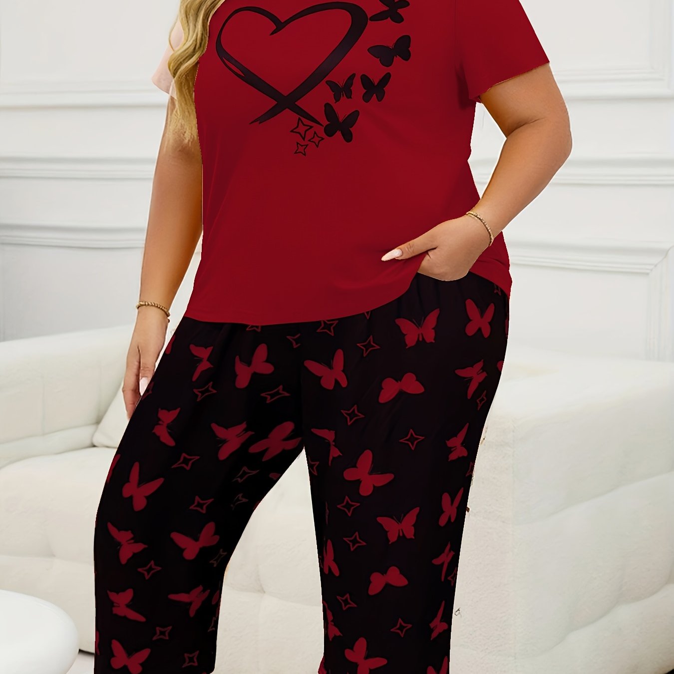 Women's casual butterfly print short sleeve t-shirt and capri pants pajama set made from polyester knit fabric with slight stretch for all-season comfort. 95% polyester, 5% elastane.