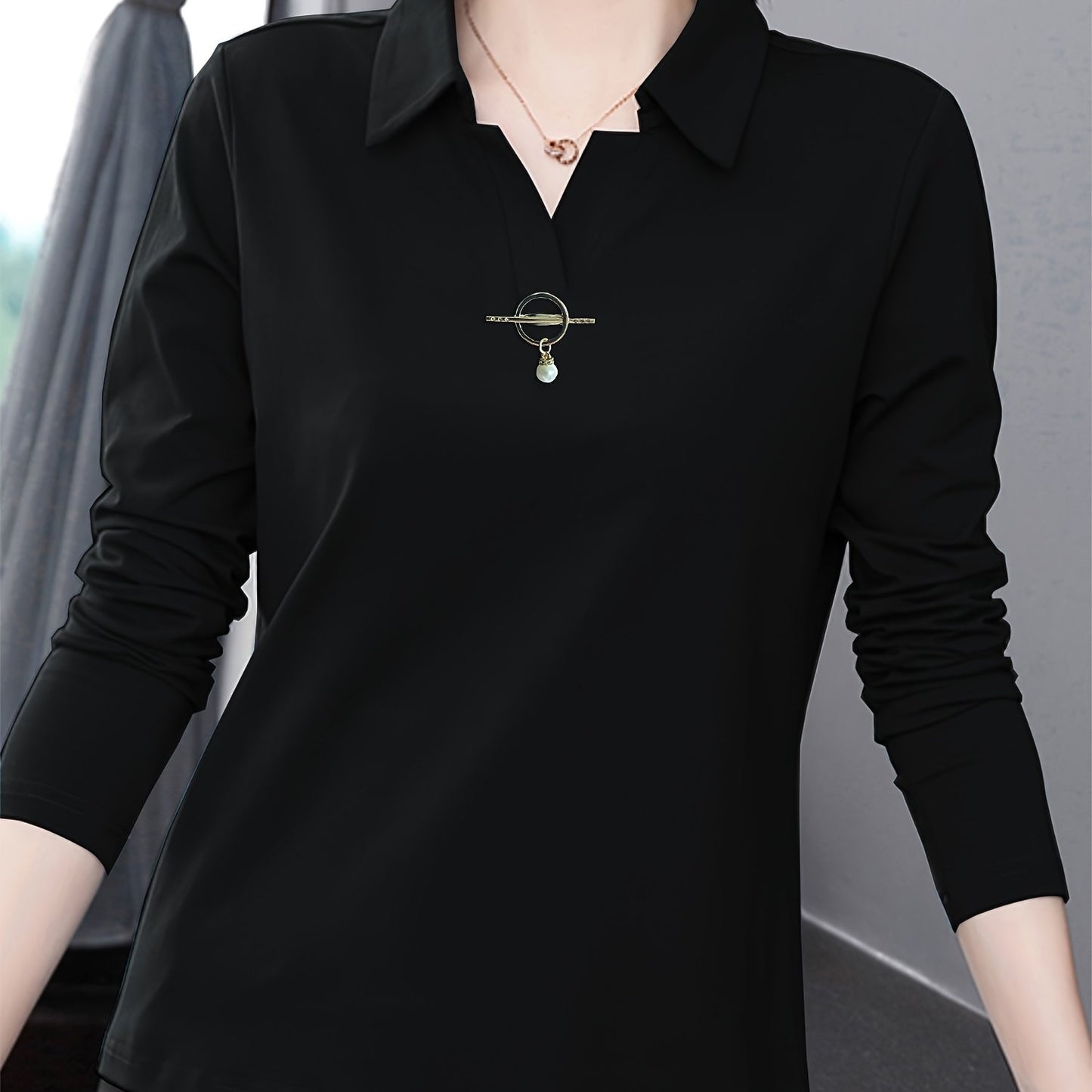 Solid color collared T-shirt for women, good for spring and fall seasons.