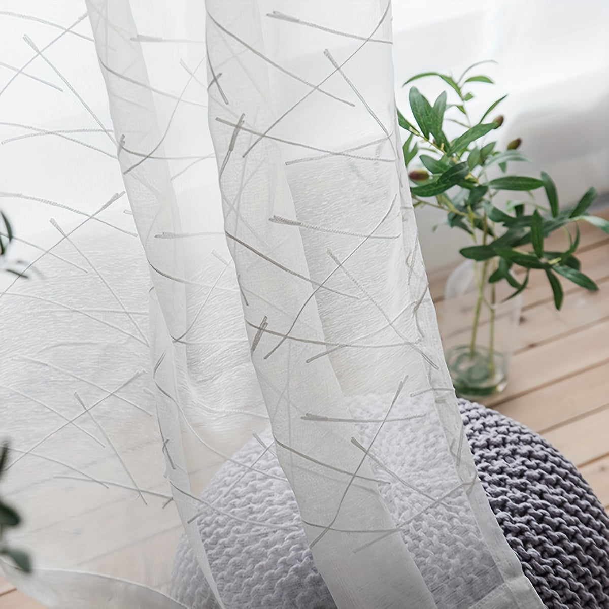 Create a modern and sophisticated look in your living room or bedroom with this 1-piece simple line embroidery sheer curtain. Featuring a sleek geometric design in white, this translucent curtain filters light beautifully while adding a stylish touch to